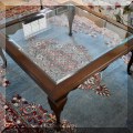 F22. Mahogany coffee table with beveled glass top. 17. 5" x 38" x 38" 